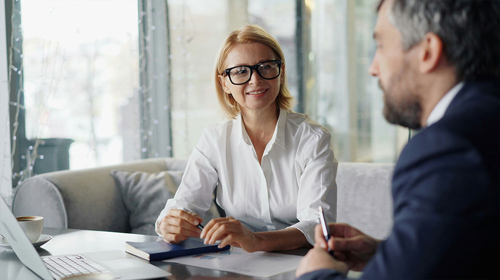 Man and woman talking together family business