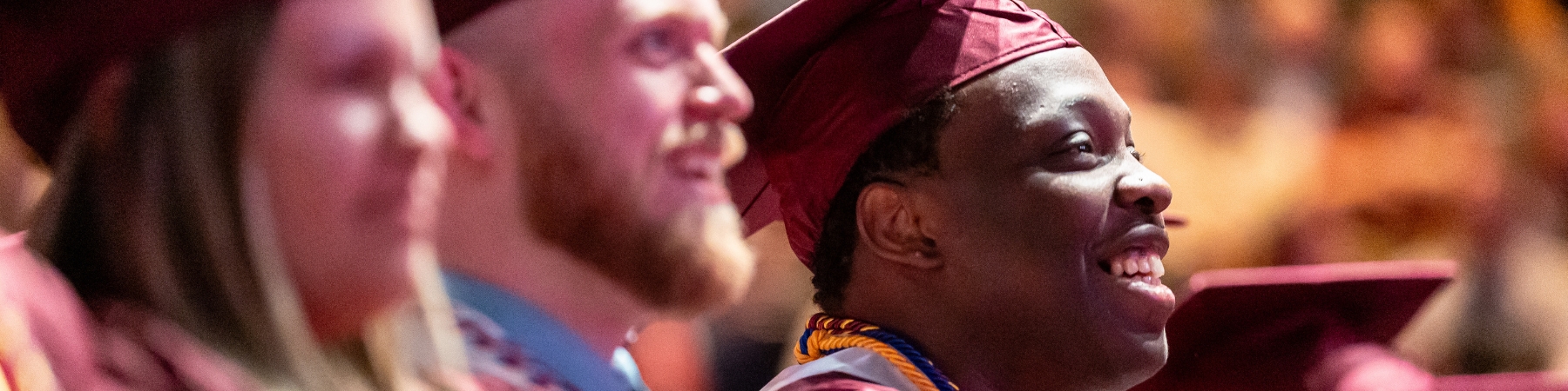 Loyola School of Continuing and Professional Studies graduates celebrating at commencement