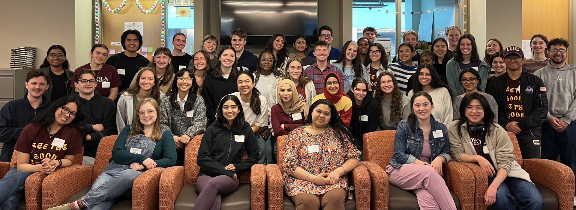 Large group of students smiling at the camera.
