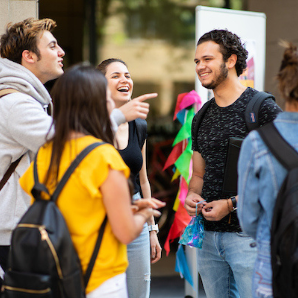 A group of Loyola University Chicago students standing outside talking