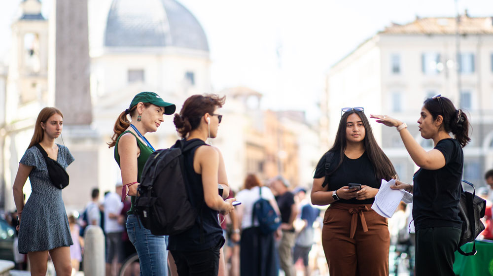 LUC students huddle together while studying abroad