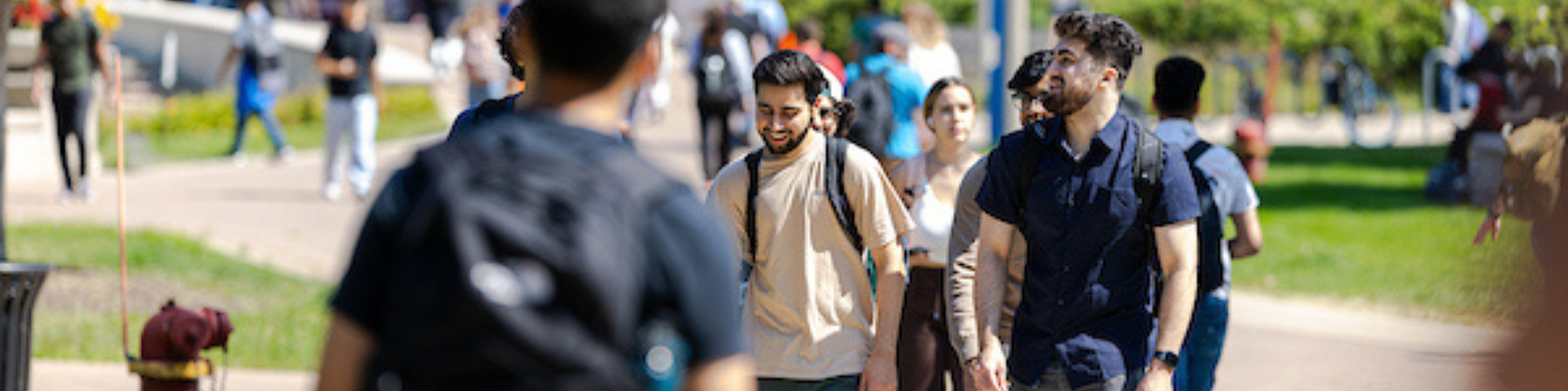 Loyola students walking across the Lake Shore campus