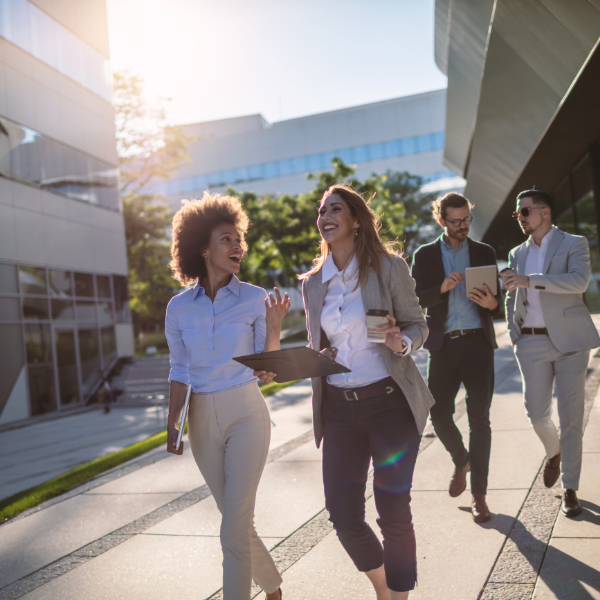 Professionals smiling outside of the workplace