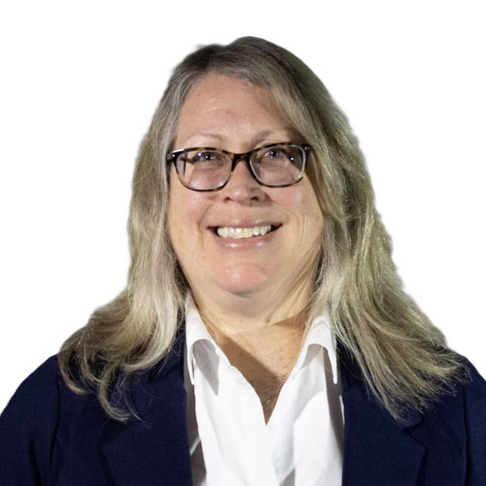 Professional headshot of a smiling woman with glasses and shoulder-length light hair on a light background