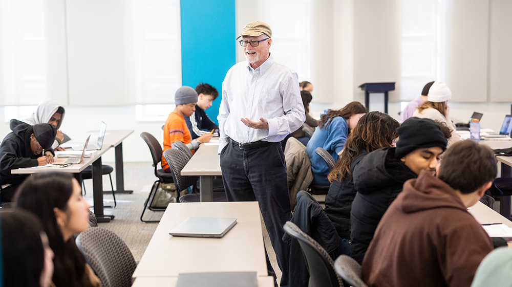 Students in a classroom with a professor speaking