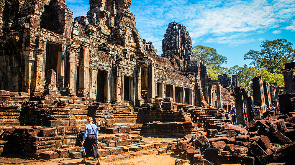  Loyola study abroad student exploring Prasat Bayon, or the Temple of Smiling Faces in Siem Reap, Cambodia