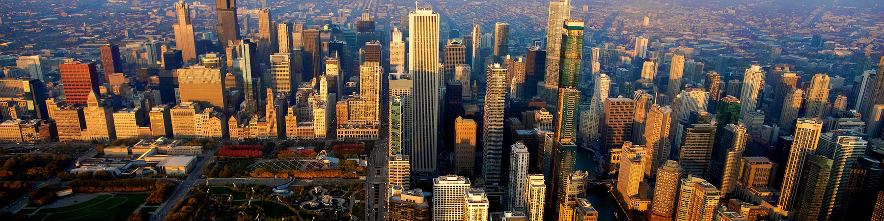 Aerial perspective of the Chicago loop building at dusk.